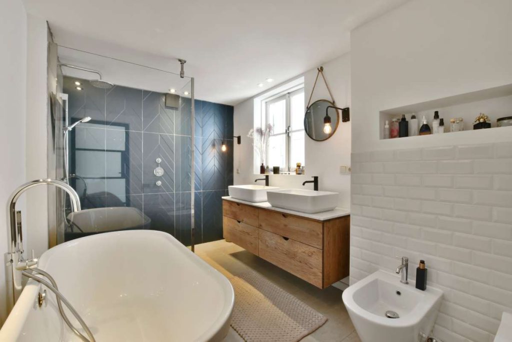 Bathroom Storage Building by Caucasian Home Improvement Worker. Elegant Modern Bathroom Interior. Interior design of beautiful and elegant bathroom