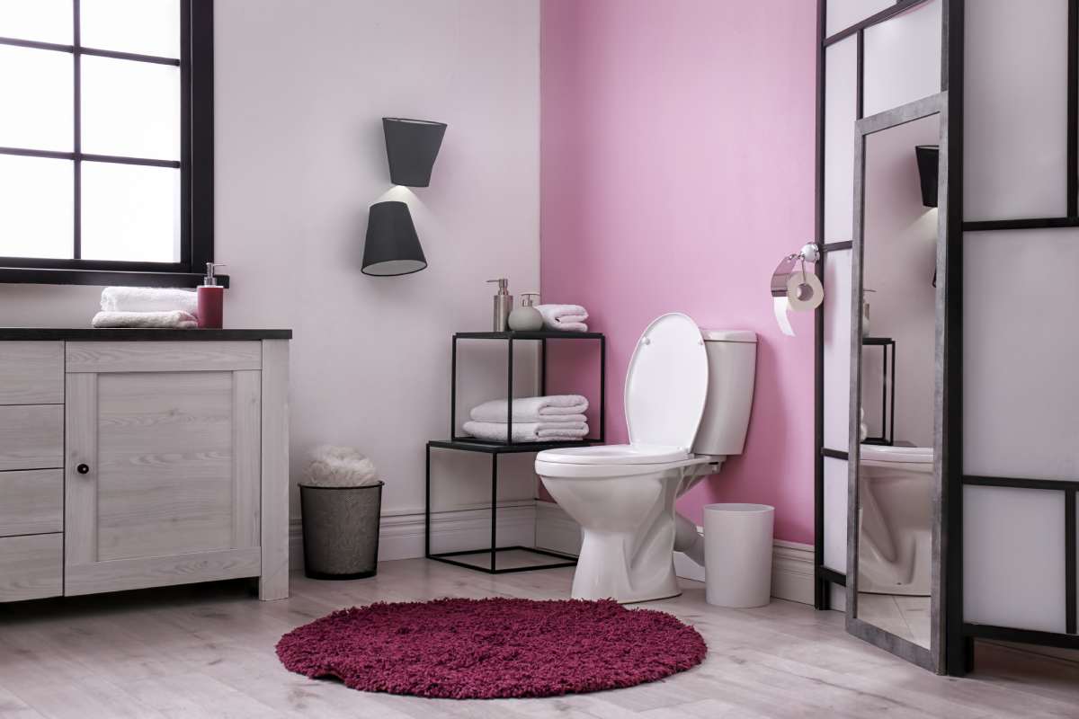 Toilet bowl in modern bathroom interior